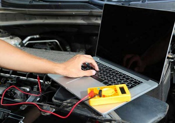 Professional Car Mechanic Working In Auto Repair Service